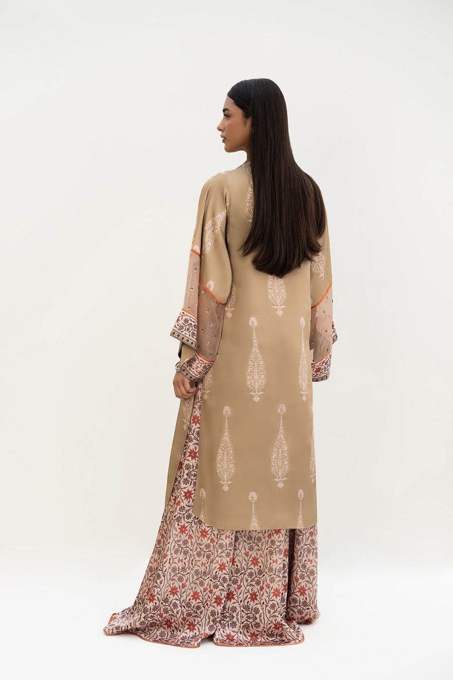 Back view of the kurta showing printed motif pattern and full length, worn with matching floral printed palazzo pants.