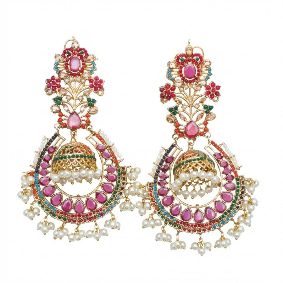 Pair of traditional jhumka earrings featuring floral motifs, pink and turquoise stones, and pearl drop embellishments photographed on a white background