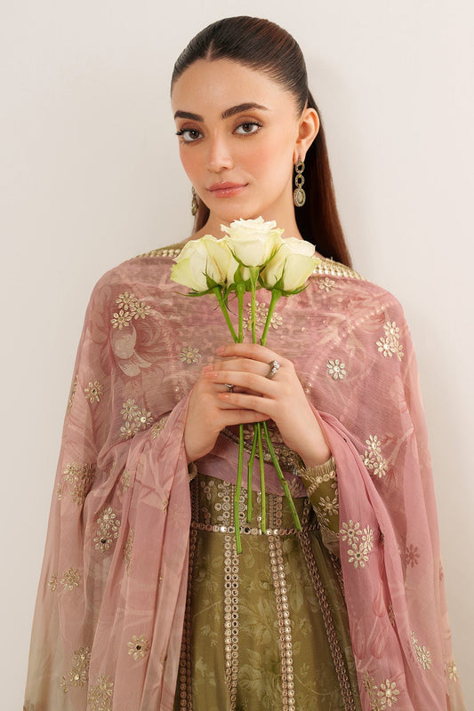 Close-up of woman holding white roses wrapped in soft pink embroidered dupatta with gold floral details