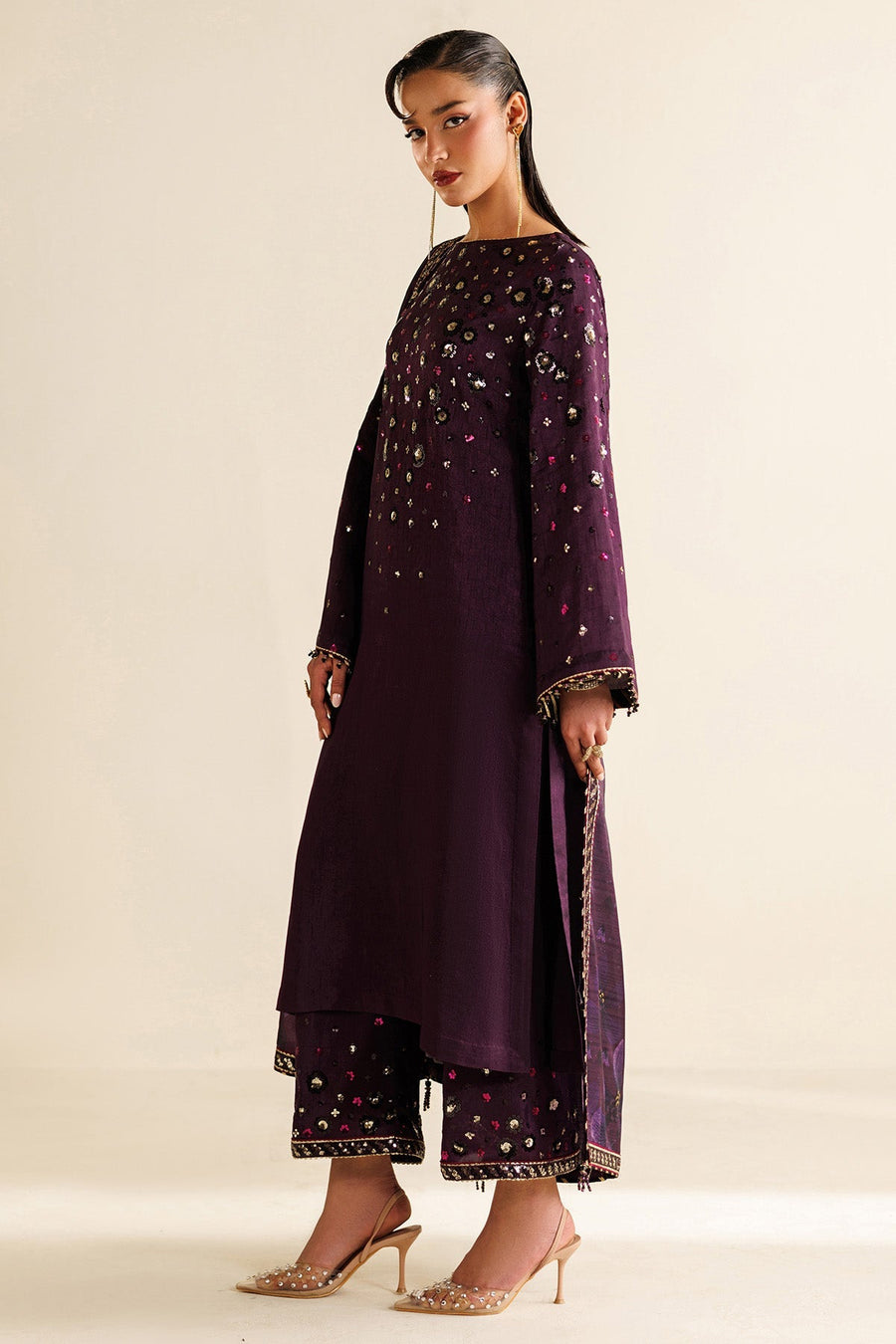 Model showing embroidered dupatta draped over shoulders with detailed bead tassels