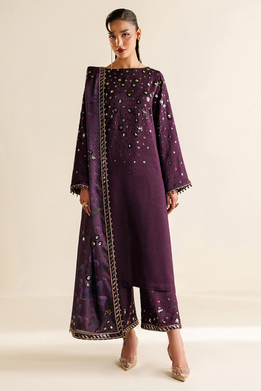 Full front view of deep plum embroidered kameez with matching embroidered trousers and floral dupatta