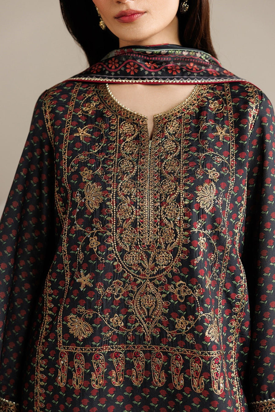 Full length view of woman standing confidently in embroidered unstitched suit set with dupatta draped