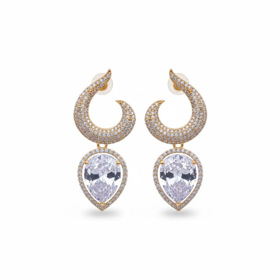 Pair of gold-plated earrings with clear teardrop gemstones displayed on white background