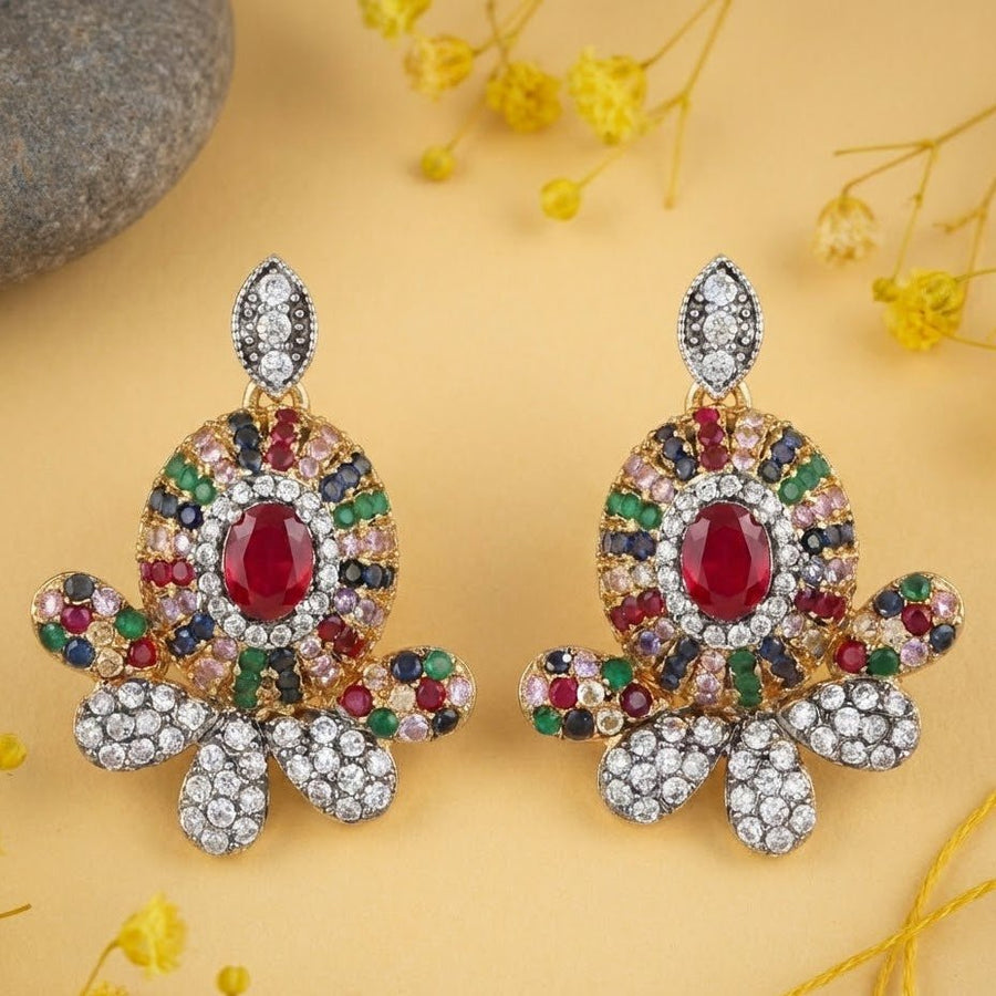 Model wearing ruby red center multicolor gemstone stud earrings with diamond accents