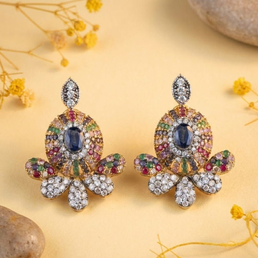 Model wearing sapphire blue center multicolor gemstone stud earrings with diamond accents and elegant updo