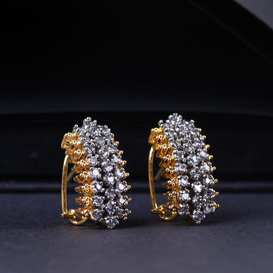 Side angle showing the clustered three-row American zirconia stones set on the gold-plated stud earrings with secure clasp closure on a dark background