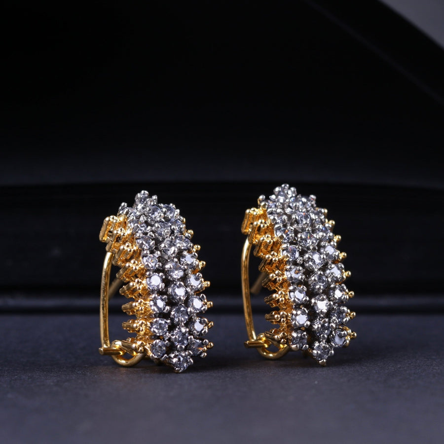 Side angle showing the clustered three-row American zirconia stones set on the gold-plated stud earrings with secure clasp closure on a dark background