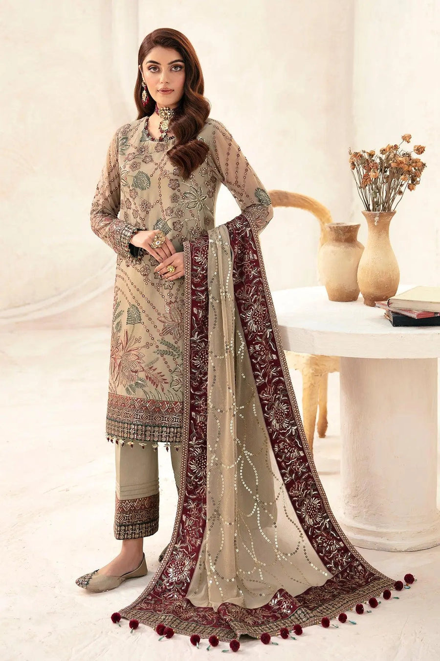 Close-up of front embroidery details and dupatta sequins with floral patterns