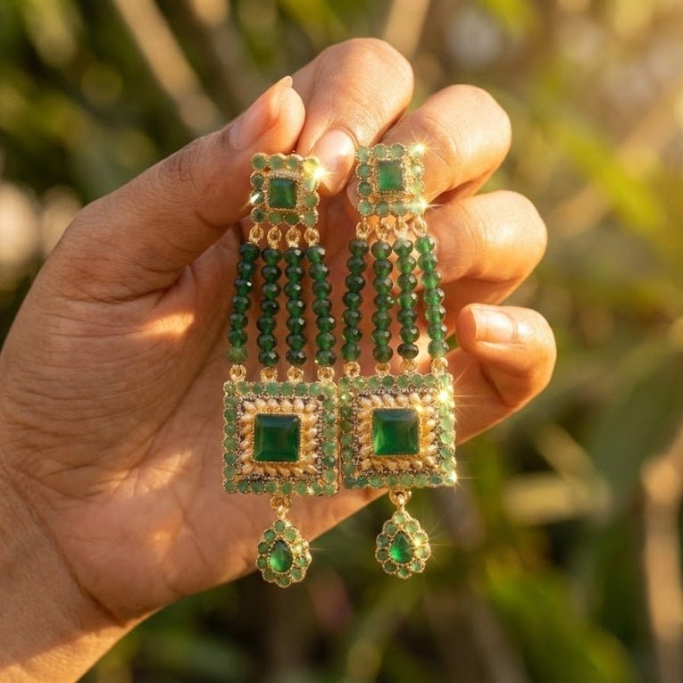 Green gemstone bead earrings worn by model with side profile showcasing length and detail