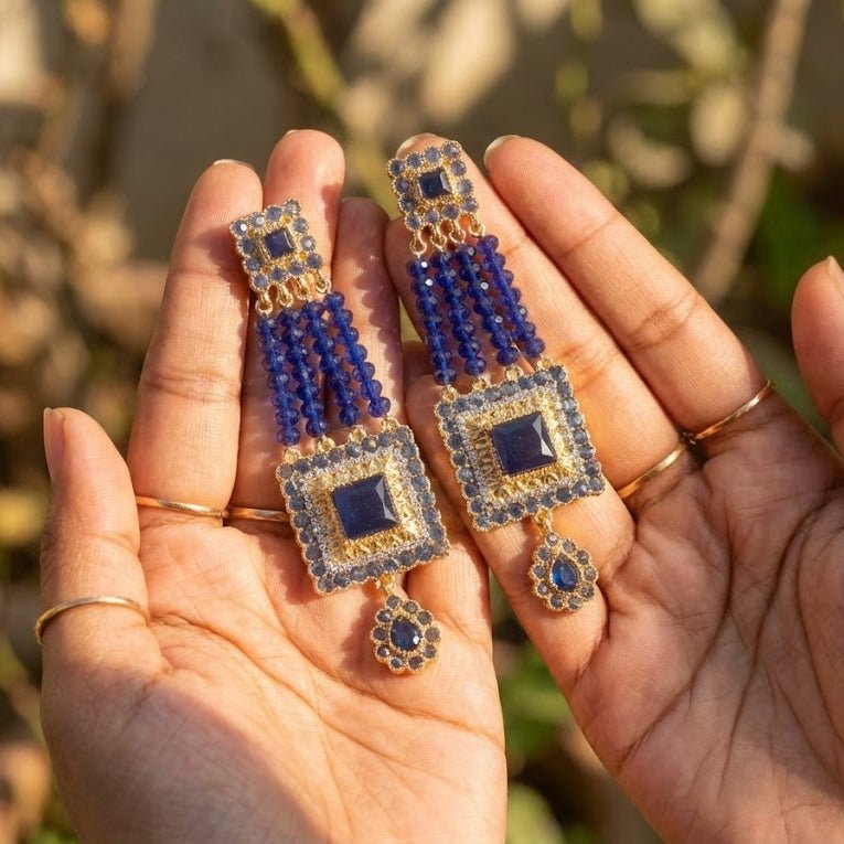 Blue gemstone bead earrings worn by model showing elegant dangle and style