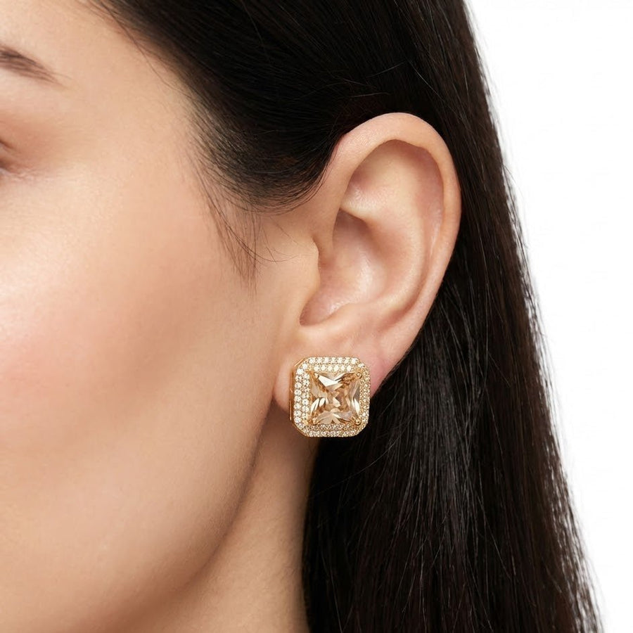 Close-up of female model wearing champagne square halo stud earring emphasizing elegant look