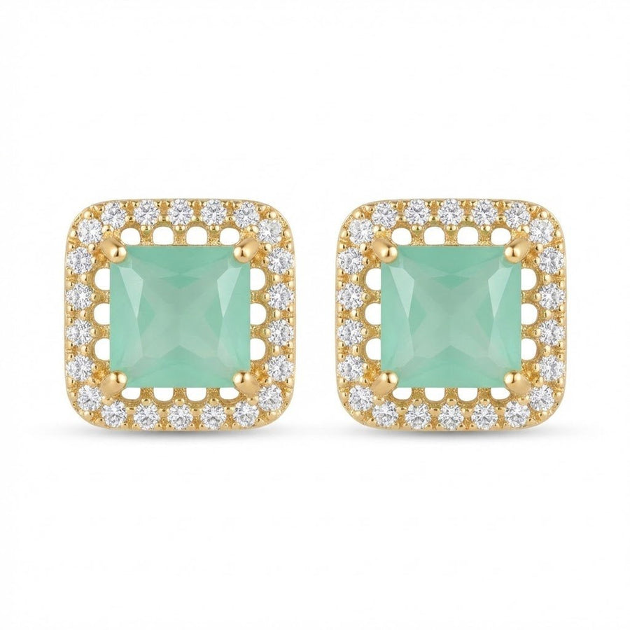 Pair of gold-tone square halo stud earrings with soft mint green square-cut center stones surrounded by sparkling round stones on white background
