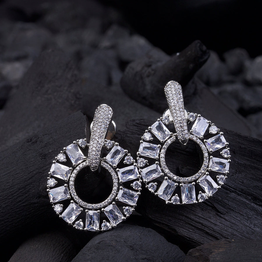 Light green baguette stone circle drop earrings with round crystals on white background